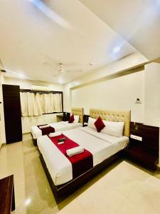 Ένα ή περισσότερα κρεβάτια σε δωμάτιο στο Hotel Mumbai International
