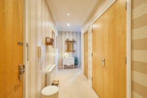 a hallway with a door leading to a bathroom at Host & Stay - The Shipshape in Seahouses