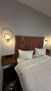 Ένα ή περισσότερα κρεβάτια σε δωμάτιο στο Автовокзал ЖК Great House