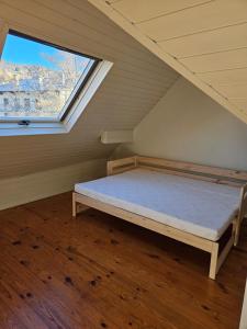 Ένα ή περισσότερα κρεβάτια σε δωμάτιο στο Casa familiar con encanto