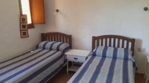 Ένα ή περισσότερα κρεβάτια σε δωμάτιο στο entrenubes