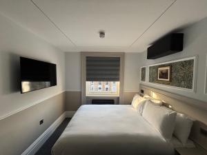 Кровать или кровати в номере MSK The Whiteley