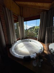 Foto sihtkohas Camanducaia asuva majutusasutuse Pousada da Cachoeira - Chalé Refúgio nas Montanhas galeriist