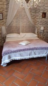 Ένα ή περισσότερα κρεβάτια σε δωμάτιο στο Bio Bonizio nel Borgo