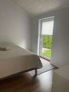 Ένα ή περισσότερα κρεβάτια σε δωμάτιο στο Cozy House By VP