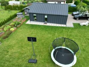 an aerial view of a backyard with a fire pit at Cozy House By VP in Anykščiai