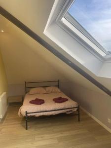 Ένα ή περισσότερα κρεβάτια σε δωμάτιο στο Appart bourg