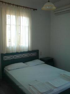 Postel nebo postele na pokoji v ubytování Odysseia Studios and Apartment