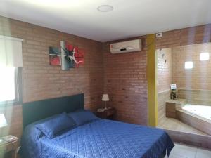 Postel nebo postele na pokoji v ubytování El Atardecer de Playas de Oro + 6 fotografií