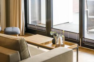 a living room with a table and two chairs at InselLoft Wohnung 1 in Borkum