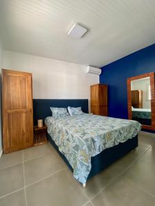 Ένα ή περισσότερα κρεβάτια σε δωμάτιο στο Logement t3 avec terrasse à Tartane