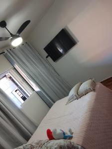 Ένα ή περισσότερα κρεβάτια σε δωμάτιο στο Casa completa aconchegante