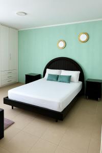 Ένα ή περισσότερα κρεβάτια σε δωμάτιο στο Azul Caribe Home