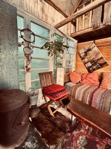 a room with a bed and a chair and a window at Al Aire Libre in San Rafael