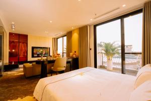 a hotel room with a bed and a desk and a room at X-Digital HOTEL in Bắc Ninh +95 photos