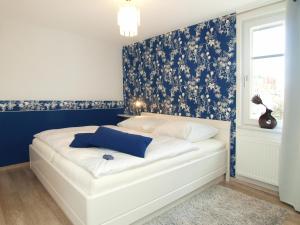 Ένα ή περισσότερα κρεβάτια σε δωμάτιο στο Brise Gartenhaus Emmi App 10