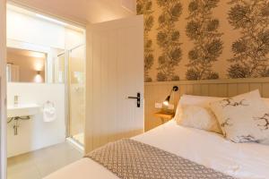 Ένα ή περισσότερα κρεβάτια σε δωμάτιο στο Irvine Bay