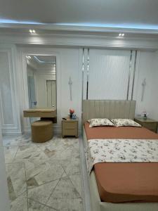 Ένα ή περισσότερα κρεβάτια σε δωμάτιο στο Dream Lux Apartment