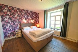 Postel nebo postele na pokoji v ubytování Le Presbytère