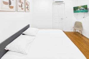 Ένα ή περισσότερα κρεβάτια σε δωμάτιο στο La parenthèse verte