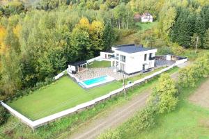 an aerial view of a house with a swimming pool at Monte Blu in Migovo