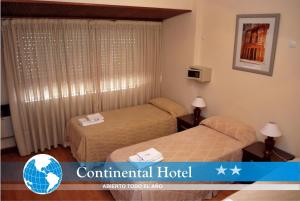 Ένα ή περισσότερα κρεβάτια σε δωμάτιο στο Continental Hotel