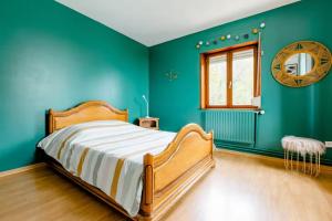 Ένα ή περισσότερα κρεβάτια σε δωμάτιο στο Chez Joséphine et Pierre