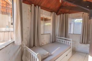 Giường trong phòng chung tại Casa com Piscina e Churrasqueira no Parque Fehr +31 ảnh