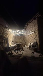 a bike parked in front of a building at night at Saint Anthony in Eggi
