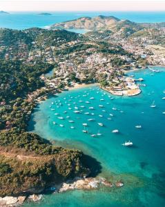an aerial view of a harbor with boats in the water at Refugio de Mar in Búzios