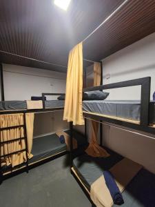 a group of bunk beds in a room at Ryo hostel in Ahangama +31 photos