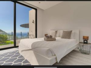 Ένα ή περισσότερα κρεβάτια σε δωμάτιο στο Villa Rubydom