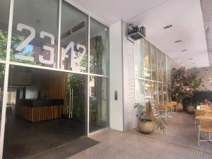 a lobby of a building with a large glass window at Montañeses 2342 Fleny in Buenos Aires