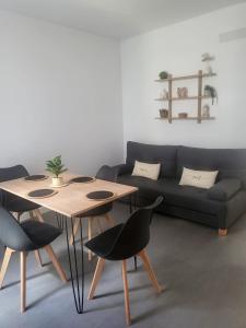 a living room with a couch and a table and chairs at Montañeses 2342 Fleny in Buenos Aires +55 photos