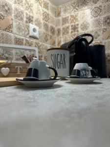 two cups sitting on top of a counter at Pindus Nest in Metsovo
