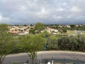 an empty street in a small town with houses at Studio rénové avec loggia et parking privatif - FR-1-553-306 in Balaruc-les-Bains