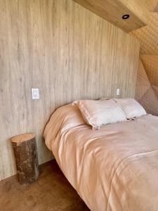 Ένα ή περισσότερα κρεβάτια σε δωμάτιο στο El Nido Domos en Potrerillos