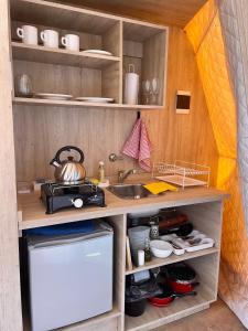 Η κουζίνα ή μικρή κουζίνα στο El Nido Domos en Potrerillos