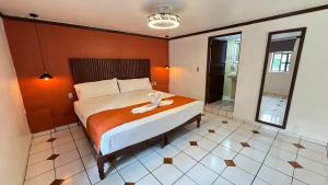 Ένα ή περισσότερα κρεβάτια σε δωμάτιο στο HOTEL ZAPOTLAN