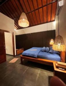 En eller flere senge i et værelse på Casamudera