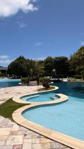 Bazén v ubytování Flat Iloa Resort Barra de São Miguel AL nebo v jeho okolí
