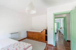 a bedroom with a bed and a mirror at 188 - Quinta da Sobreda in Benavente