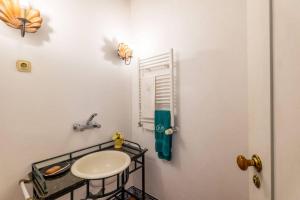 a bathroom with a sink and a towel on the wall at 188 - Quinta da Sobreda in Benavente
