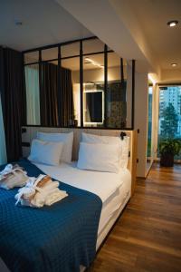 Ένα ή περισσότερα κρεβάτια σε δωμάτιο στο Hotel Lonca