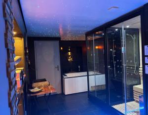 a view of a room with a kitchen with glass walls at Work in spa in Voiron