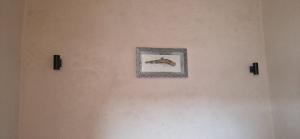 a painting of a fish on a wall at Chez Brahim vue panoramique in Aït Ben Haddou