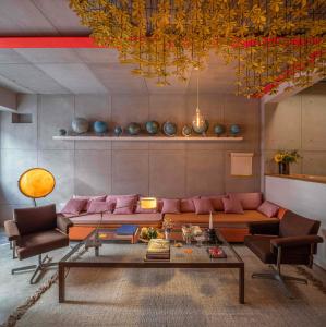 a living room with a couch and a table at toctoctoc lisboa in Lisbon