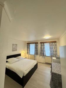 Ένα ή περισσότερα κρεβάτια σε δωμάτιο στο Landhotel Waldschänke