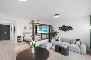 a living room with a couch and a table at High-Rise Luxury Condo in Downtown Miami in Miami +10 photos