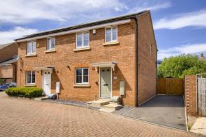 a brick house with two doors on a brick street at NEW! Private Driveway, Spacious, 2 Bathroom, Fast WiFi in Berkswell